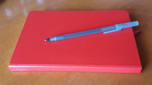 Red notebook and pen